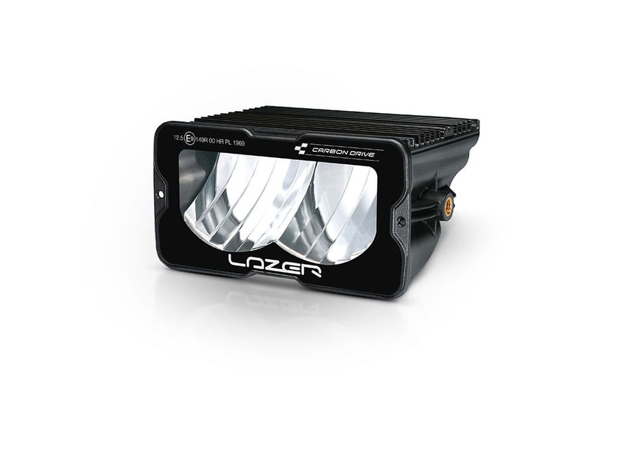Lazer Lamps Carbon-2 Drive LED light with backlight and yellow dip, angled view showing sleek black housing and bright illumination.